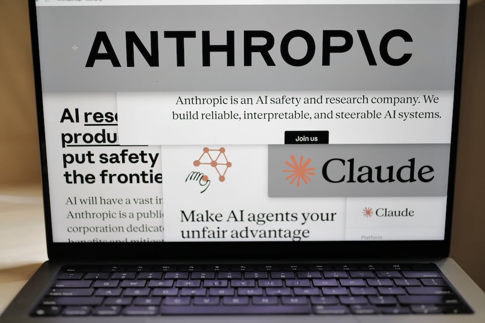 FILE - Pages from the Anthropic website and the company's logos are displayed on a computer...
