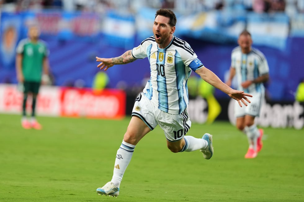 Argentina's Lionel Messi (10) celebrates after scoring the opening goal during the World Cup...
