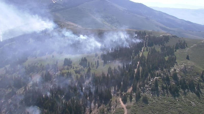 Smoke may still be visible as the fire continues to burn vegetation in previously unburned areas.