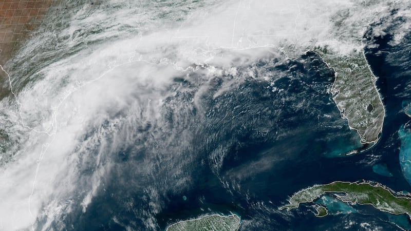 This GOES-19 GeoColor satellite image provided by NOAA, shows a storm system forming along the...