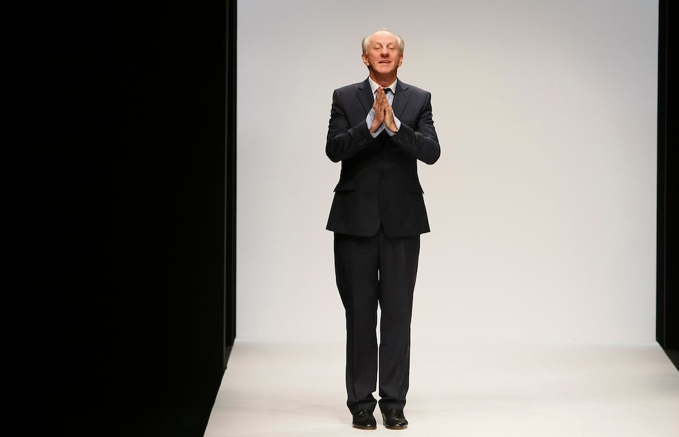 FILE - Designer Paul Costelloe reacts to the audience after his Autumn/Winter 2010 collection...
